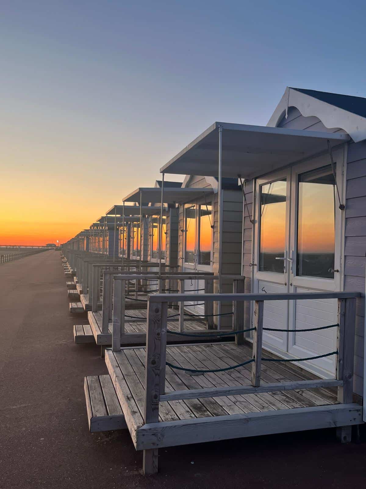 Row of beach huts at sunset in Lytham St Annes