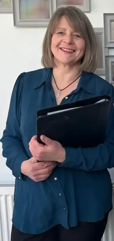 Smiling woman holding a black folder
